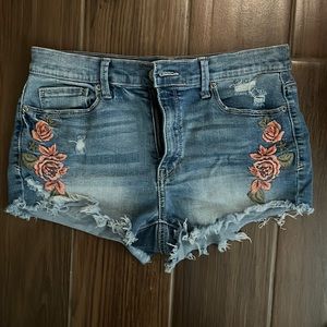 Mudd stretchy medium wash denim high rise jean shorts with rose embroidery